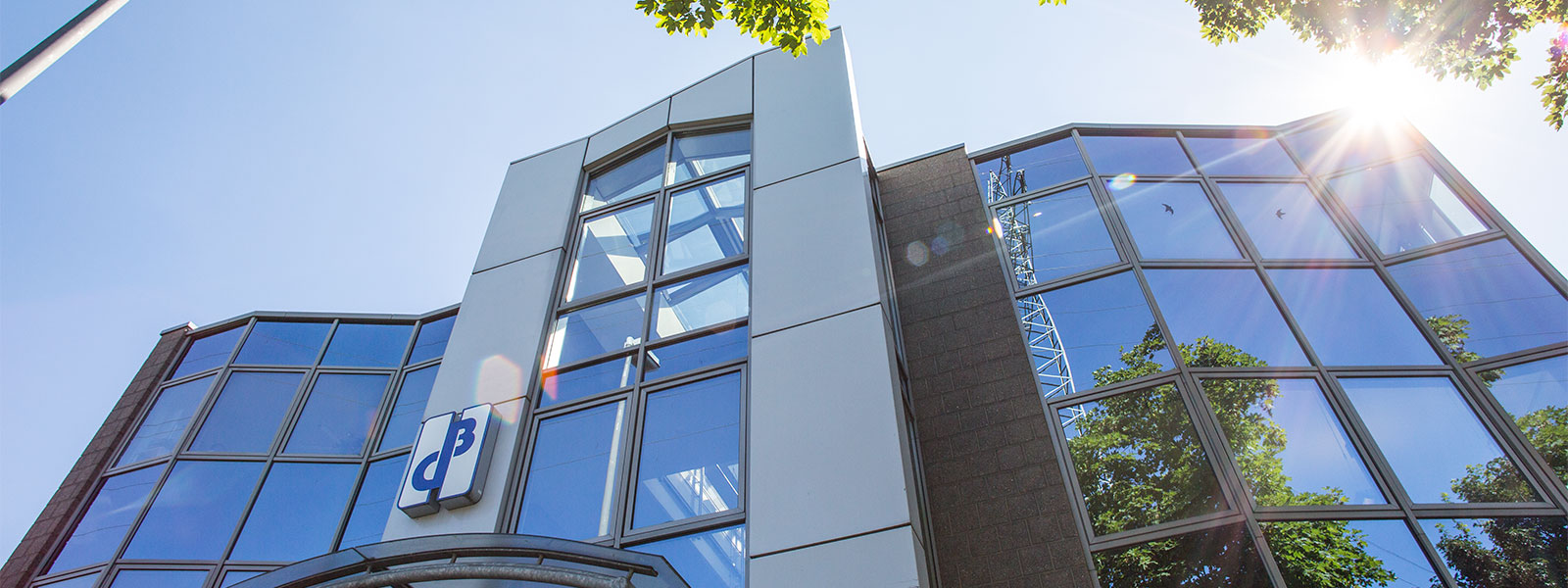 Glass frontage of the Druckguss Westfalen Behringer building in Velbert